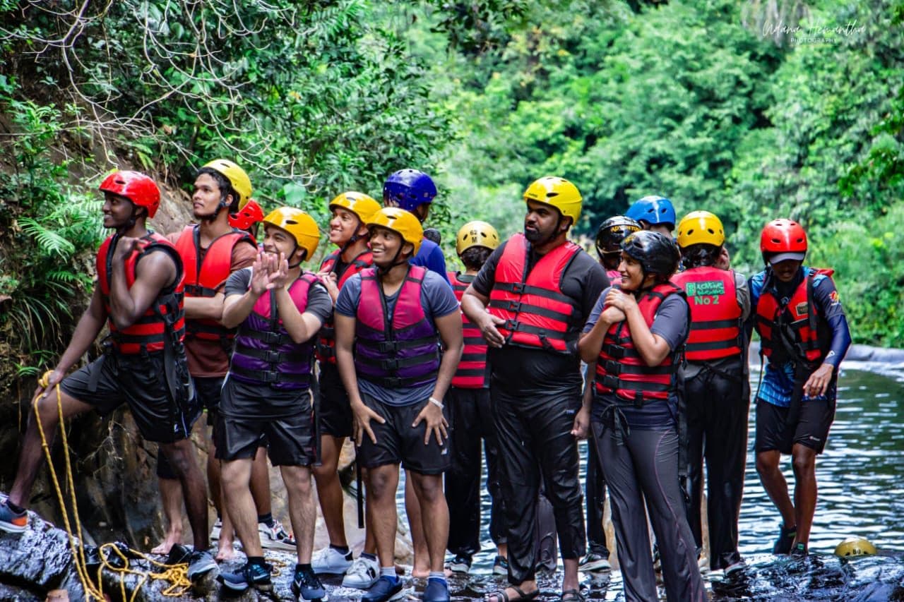 Xclusive Adventures guide delivering a safety briefing before a river activity in Kitulgala